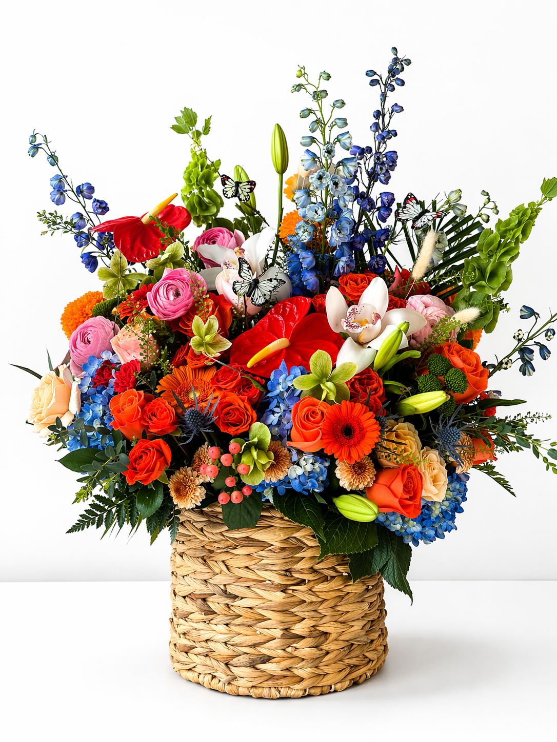Vibrant floral arrangement in wicker basket – Elise Flowers, Tamarac FL